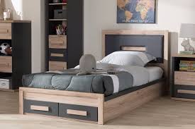 Intelligently designed, this sturdy bed uses steel supports and solid and composite wood slats to hold a standard mattress (not included). Baxton Studio Pandora Modern Dark Grey Light Brown Two Tone 2 Drawer Twin Size Storage Platform Bed Br990051 Dark Grey White Oak Twin