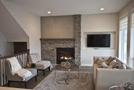 Staged To Sell By Stage Right Lethbridge The Living Room In The Empire Homes Show Home Features A Beautiful Offset Fireplace The Home Fireplace Family Room