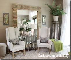 Love This Huge Mirror Leaning Against The Wall With Two Chairs And A Table Grouped In Front Of It By Twila Living Room Pictures Home Decor Home