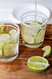 In a large pitcher combine the white wine, tequila, triple sec, orange juice and lime juice. How To Make This Lemon Lime Sangria Margarita Recipe Posh In Progress