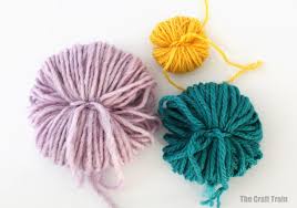 Then, cut a slit from the outer circle to the smaller one. Diy Cardboard Pom Pom Maker The Craft Train