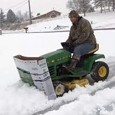 Clever Man Plows Snow Using A Large Cardboard Tv Box Attached To The Front Of A Riding Lawn Mower Lawn Mower Snow Plow Snow Plow Lawn Mower