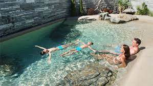 biodesignpools poolbau partner kriegergut ihr personliches strand und badehighlight hinterhof strand naturschwimmbad poolbau