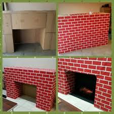 I have created a stained wood cover that fits directly over. Santa S Entrance Fireplace Made From Cardboard Boxes Diy Christmas Fireplace Cardboard Fireplace Christmas Fireplace