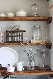 Open shelves in dark wood, white calcutta marble backsplash and library sconces give this updated kitchen a fresh farmhouse look, designed by lindye galloway. Styled Dining Room Shelving Dining Room Shelves Kitchen Remodel Dining Room Shelving