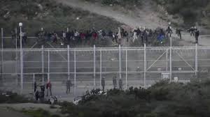 An amazing little city with an interesting history, ceuta is one of several. Migrants Storm Border Fence In Spanish Enclave Of Ceuta Ceuta Enclave Border
