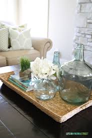 Available in an assortment of colors, this functional tray blends easily with any décor and given its simple design, it looks fantastic with a rustic table. Remodelaholic Why You Should Use Trays In Your Home Decor