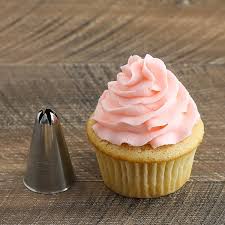 Hold the cupcake by the paper bottom, and dip the top in the frosting, which can be tinted any color you wish. How To Frost Cupcakes Step By Step Tutorial With Video