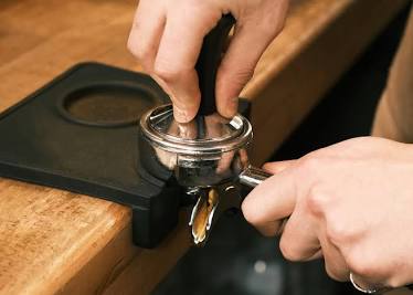 Even tamping is critical to prevent channeling., AI generated