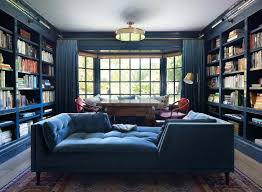 The drapes, sofa, rug, and wall accent in soft navy give a very stylish color touch to the room with the white walls and wood flooring. Beautiful Blue Living Room Ideas