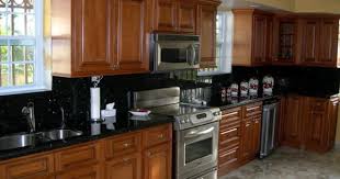 Pin By Mary Beth Mcdaniel On Kitchen Cherry Cabinets Kitchen Oak Kitchen Cabinets Black Countertops