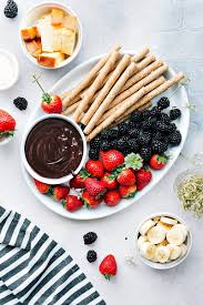 Divine white chocolate fondue in which to dip summer fruits. Easy Chocolate Fondue 5 Ingredients Chelsea S Messy Apron