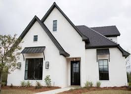 Though it may seem counterintuitive to have a simple color be awarded that distinction, it's a versatile, neutral color and can be used in so many different settings that it's worth celebrating it. Sherwin Williams Sw 7008 Alabaster Exterior Black Front Door Paint Color Sherwin Williams Tric Traditional Home Exteriors Exterior House Options House Exterior