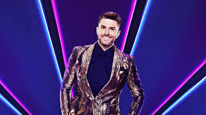 With only 7 costumed characters still in the running to win the masked singer, 4 took the stage on wednesday. The Masked Singer Presenter Joel Dommett Explains Why We All Need The Show