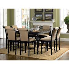 This table showcases a square tabletop resting upon sturdy block legs. Infini Furnishings 9 Piece Counter Height Dining Set Counter Height Dining Room Tables Square Dining Tables Black Dining Room