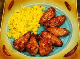 — reprinted from michael symon's playing with fire. Nibble Me This Sriracha Wings Saffron Rice