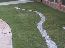 Essentially trenches of stones covered with fabric, then topped with soil, drains benefit from nondegradable fabric. French Drain Installation In Sun Or Shade Installation In Oklahoma City Norman Edmond Lawton Oklahoma Drainage And Sprinkler Repair 405 203 9419