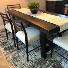 Dining tables are multifunctional spaces for eating, working, socialising and playing. Reed Extending Dining Table Pottery Barn