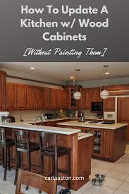 Give instant visual interest to your kitchen by mixing and matching multiple materials and textures. How To Update A Kitchen With Wood Cabinets Without Painting Them Designed