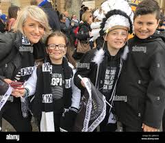 left-right) Collingwood fans Elizabeth Bargas, Hope Bargas, 9, John Bargas,  11, and Yianni Pappas, 12, are seen during the AFL Grand Final Parade in  Melbourne, Friday, September 28, 2018. (AAP Image/Amber Wilson