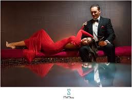 Sitting on modern sofa chair. High Fashion Couple S Photography At Exquisite Bubble Bar