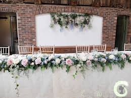 Top Table Garland And Hanging Flower Backdrop Rustic Wedding Flowers Owen House Barn Dusky P Bridal Table Flowers Wedding Top Table Wedding Table Garland
