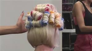 Starting at the top, grab a handful of hair on the middle part and roll it down then repeat steps until all sections of your hair are rolled into hot rollers. How To Put Your Hair In Hot Rollers How To Curl Short Hair Hot Roller Curls Hair Rollers