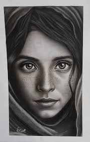 Aspiring artist admires drawings and paintings