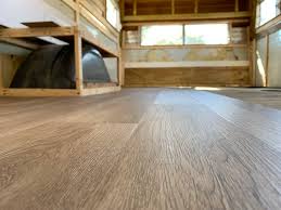 This is the top choice for wood and laminate flooring transitions to another hard i'm looking on how to install a metal transitional piece to the edge wood flooring on concrete floor on the edge of a step. The Cameo Camper Renovation Why How We Installed Vinyl Plank Flooring Lone Oak Design Co