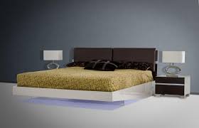 The platform bed (with storage underneath) has an extended edge that helps lead the eye into the suspended nightstands that have a. Soflex Birmingham Modern Brown Oak Eco Leather Headboard Floating Eastern King Bed With Led Lights Soflex Birmingham Ek