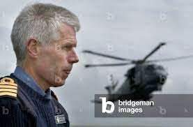 Image of CAPTAIN ALAN MASSEY STANDS ON DECK OF ARK ROYAL AS