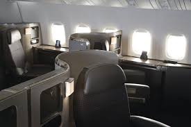 Whilst both can be used by first class passengers, the 1 on the port is slightly larger than the 1 in the center. American Airlines Boeing 777 300er First Class Seats Compliments Of American Airlines Travel Tips