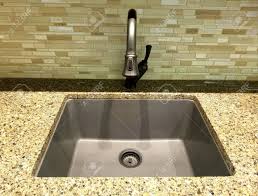 Check spelling or type a new query. Stainless Steel Kitchen Sink And Faucet With Light Marble Countertop And Green Glass Wall Tiles Stock Photo Picture And Royalty Free Image Image 146417118