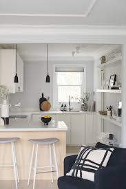This contemporary kitchen combines pure white handless units with a concrete inspired central island. New Interior Project A Light Filled Minimalist Kitchen And Living Room