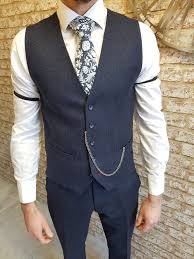 A wide band of horizontal bead work at the hipline separates the honeycomb beaded pattern on the bodice and skirt of this 1920's dress. By Order Of The Peaky Blinders You Need These Sleeve Garters Mens Outfits Wedding Suits Men Peaky Blinders Fancy Dress