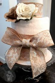 The wedding cake starts with 3 bath towels, a hand towel, some pins, and two bows or flowers. How To Make A Towel Cake For A Bridal Shower Big Bear S Wife