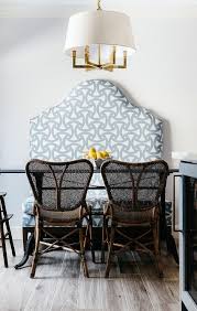 A Six Light Square Tube Chandelier Lights A Dining Table Flanked By Selamat Clemente Arm Chairs And A T Gold Dining Chairs Green Dining Chairs Dining Room Blue
