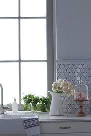 These hexagon tile backsplashes are lovely, and come in many styles, so you can find just the right one to make your kitchen dazzle. White Marble Hexagon Kitchen Backsplash Transitional Kitchen