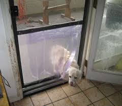 The magnetic closure will help make sure you aren't. Easy Inexpensive Doggy Door In A Screen Door Screen Door Dog Screen Door Diy Screen Door