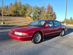 Image result for Light Rosewood 1995 Chrysler
