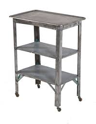 We carry phenolic, steel and wooden tables. Refinished Vintage American Medical Three Tier Brushed Pressed And Folded Steel Mobile Work Stand Or Table