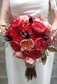 They take on their own natural shape with a few more wildflowers and seasonal fillers, like dried grasses and berries, and the color palette shifts to a moodier combination of jewel tones. Style Me Pretty The Ultimate Wedding Blog Page 43 Wedding Bouquets Pink Flower Bouquet Wedding Red Bouquet