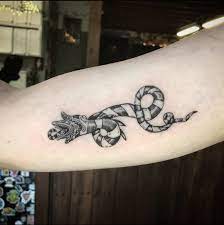 This celtic symbol with a dragon is a masculine tattoo, perfect for older men! Beetlejuice Beetlejuice Beetlejuice Tattoo Me Charlotte Facebook