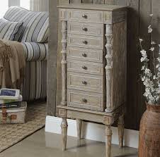 The design includes a pullout lower drawer, a pair of pivoting middle drawers and. August Grove Muller Solid Wood Jewelry Armoire Wayfair