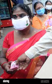 Kolkata, India. 01st Dec, 2020. Social activists and sex workers take part  in a campaign rally to create awareness about HIV AIDS on the occasion of  World AIDS Day at Sonagachi, Red