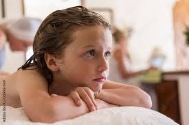 shirtless 5 year old boy at home Stock Photo