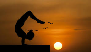 Woman Doing An Acrobatic Yoga Pose Silhouetted Against Sunset Yoga Balance Nature Handstand Roof Pose Bea Yoga For Beginners Beginner Poses Yoga Steps