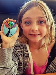 What is the story behind the rock found at Palafox Pier?