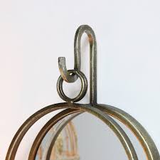 Maybe you would like to learn more about one of these? Antiqued Gold Mirror With Candle Sconce