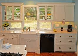 Double Sided Glass Door Cabinets In Front Of Window Combine Decorative Storage And Keep Coastal Kitchen Design Traditional Kitchen Design Kitchen Window Design
